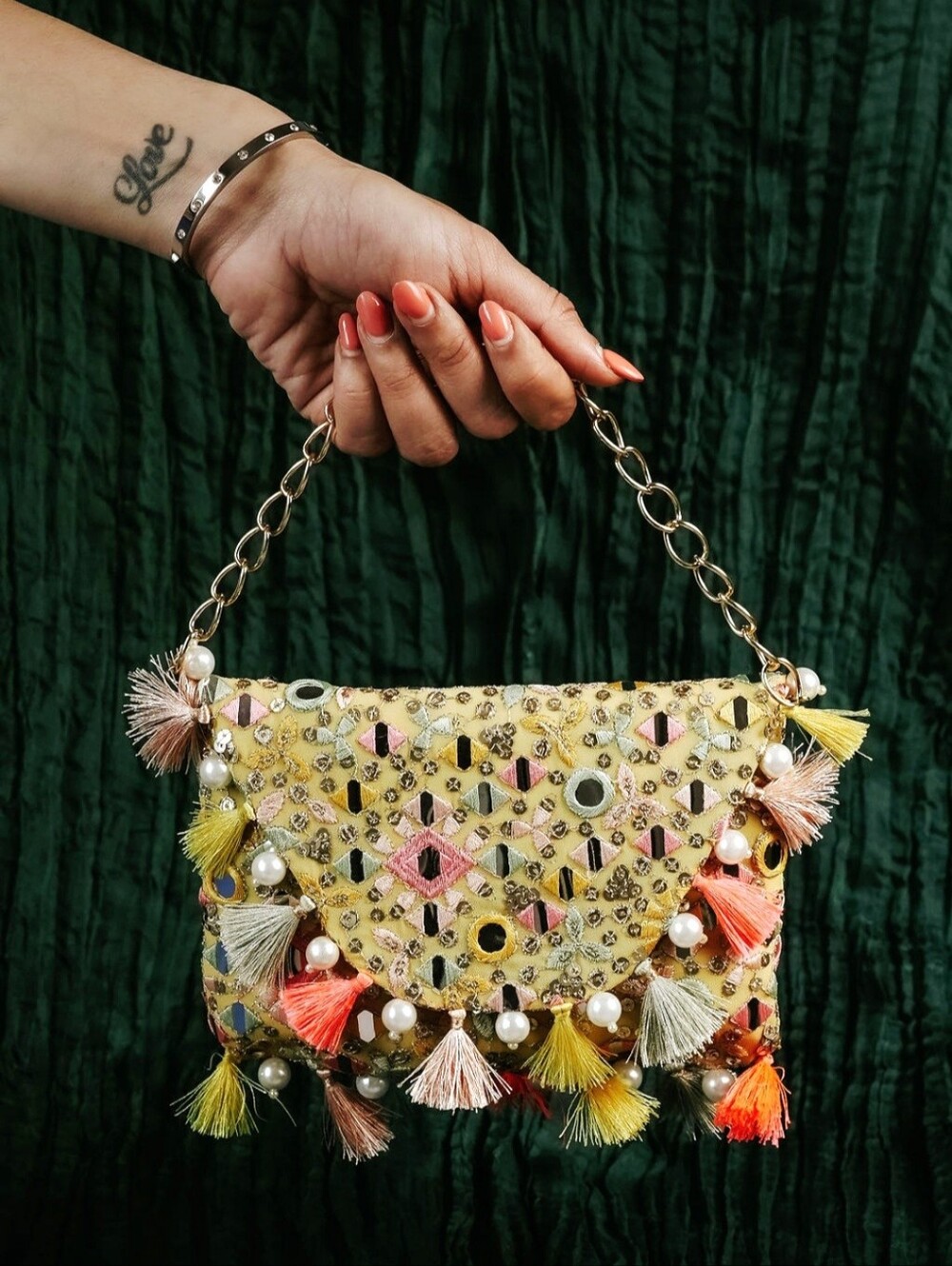 Embellished Yellow Tassel Handbag with Pearl Accents
